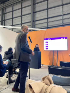 A photo of Dr Iqbal Malik speaking at pcr london valve event